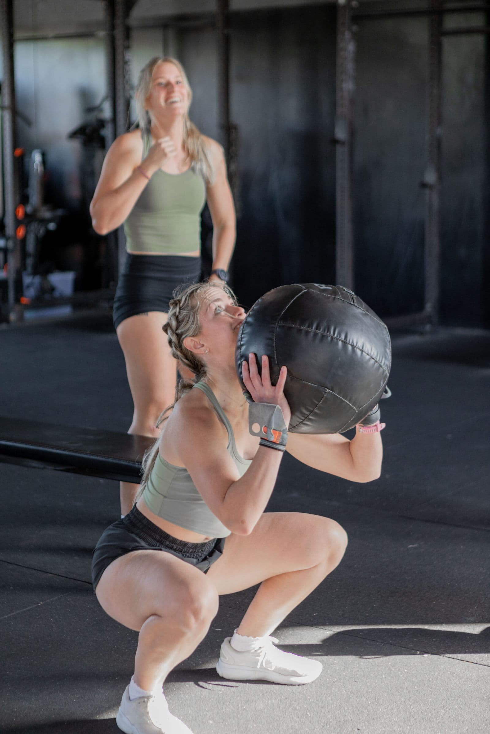 Two athletes doing wall balls at CrossFit Aggieland